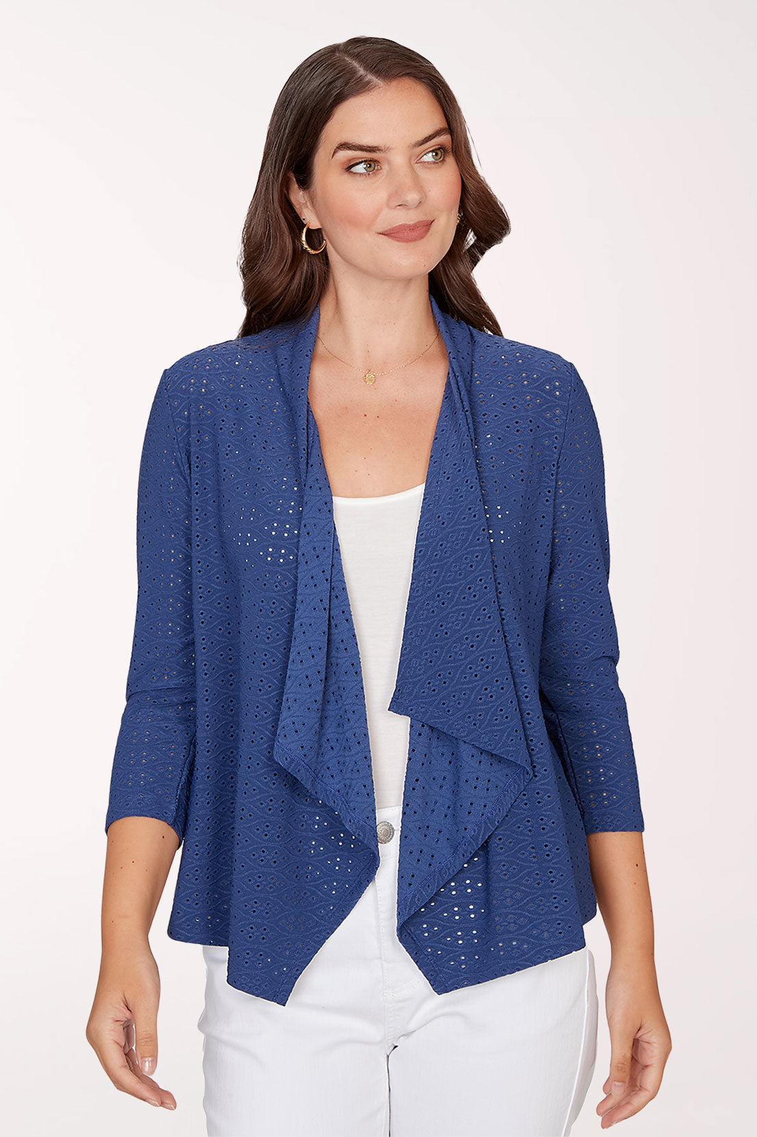 Woman wearing a blue cardigan with a white background