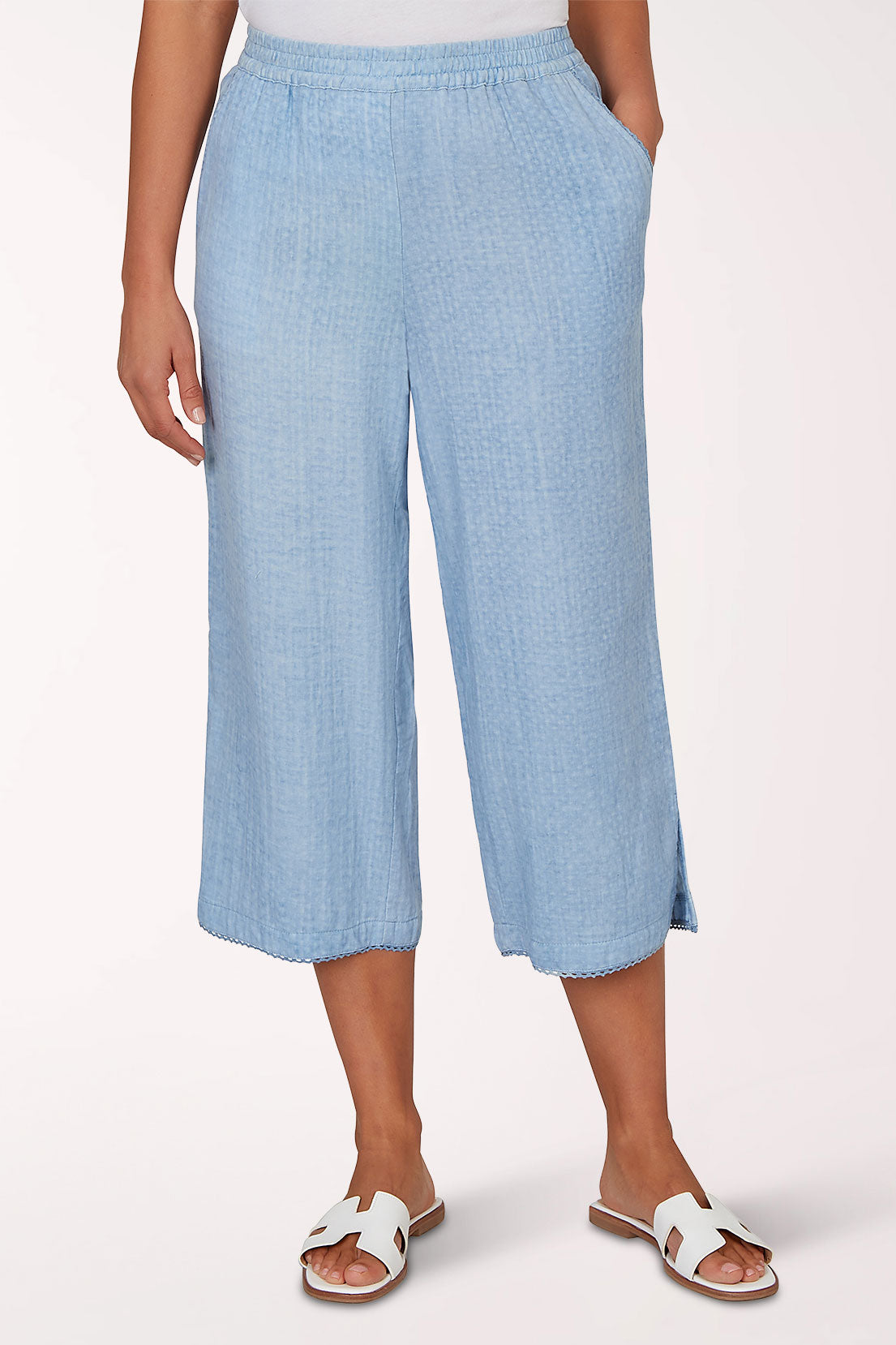 Woman wearing a light blue crop pant.