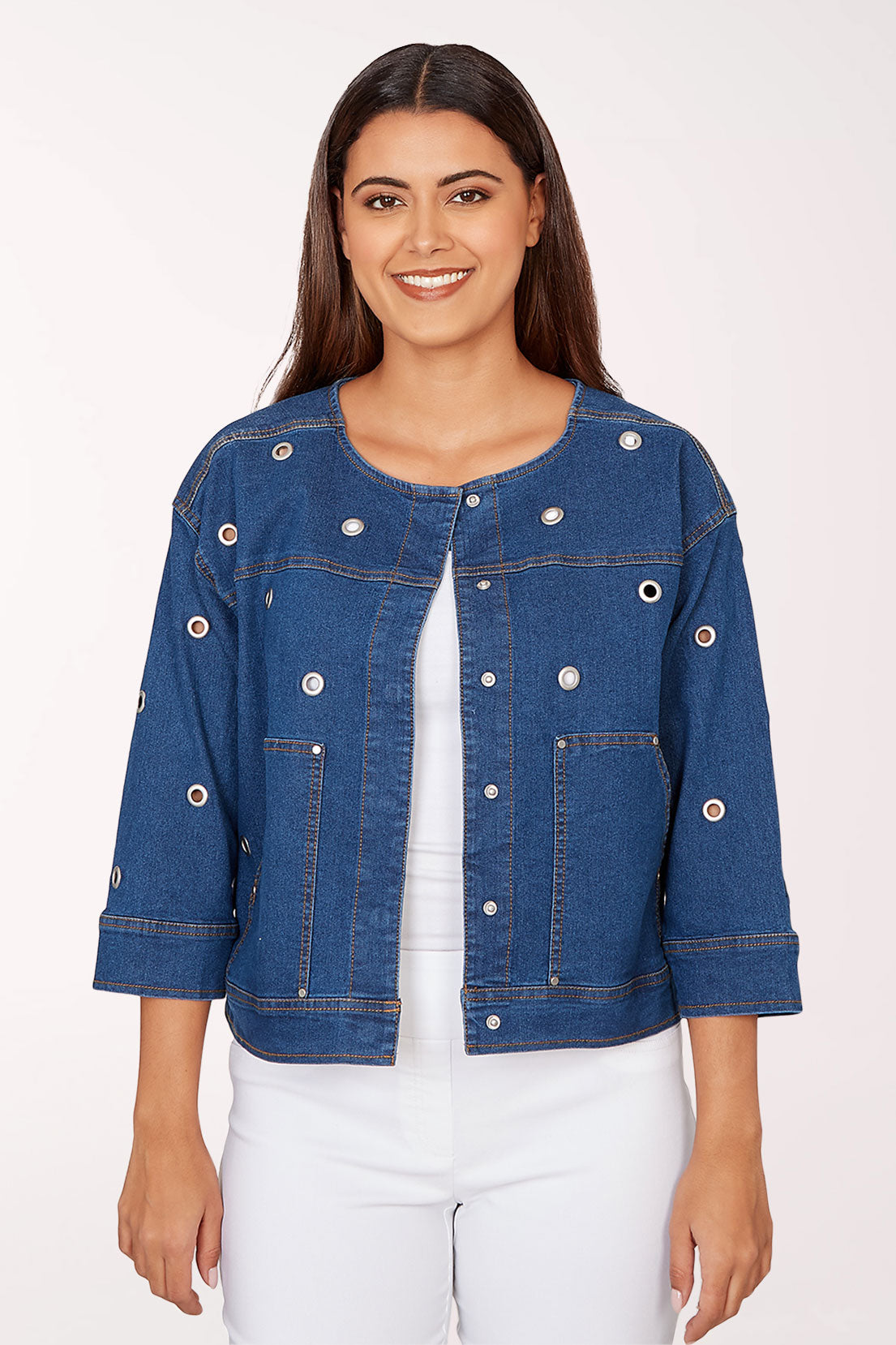 Woman wearing a blue denim jacket on a white background