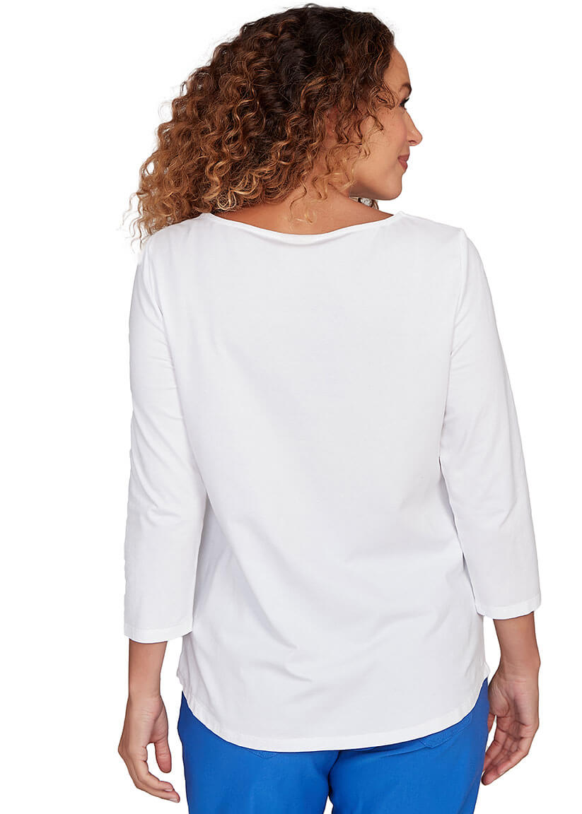 Woman wearing a white blouse and blue pants on a white background
