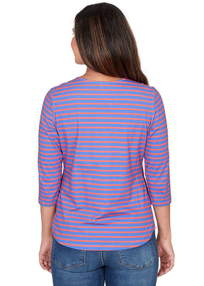 Woman wearing a blue and pink striped shirt on a white background