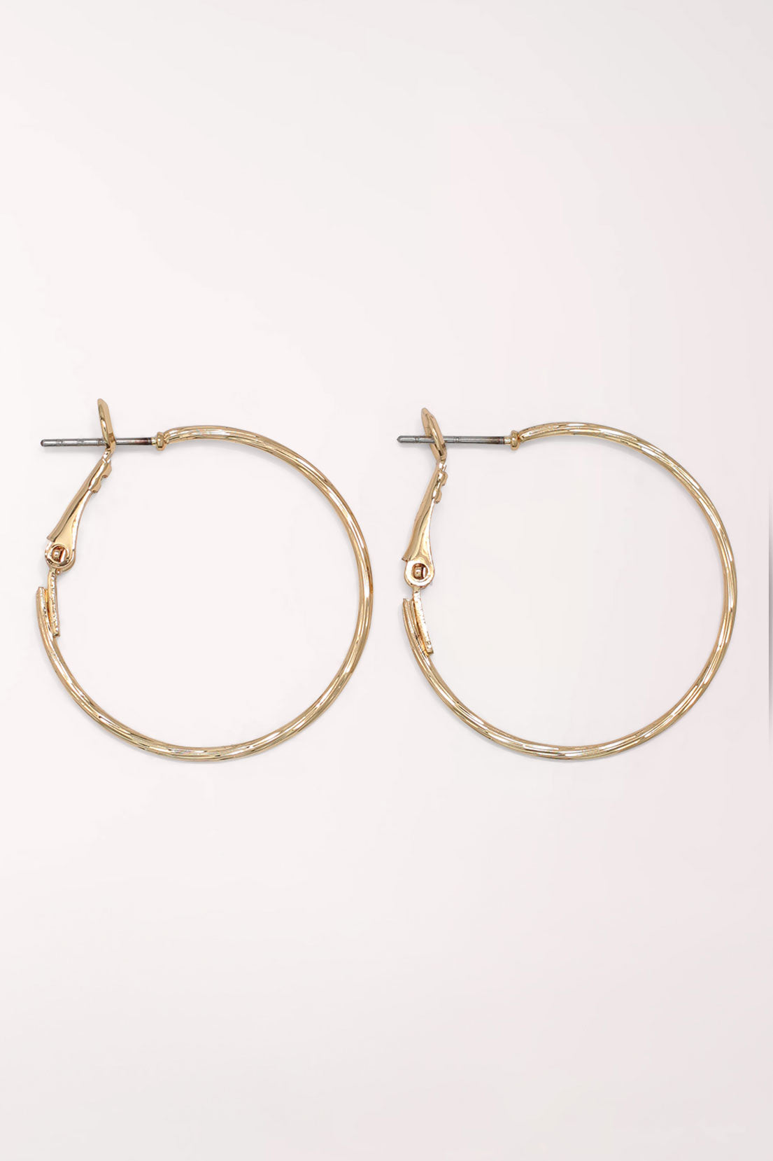 Pair of Periwinkle Gold Delicate Textured Hoop Earrings: thin gold-tone hoops with a lightly hammered texture and a snapback post closure.