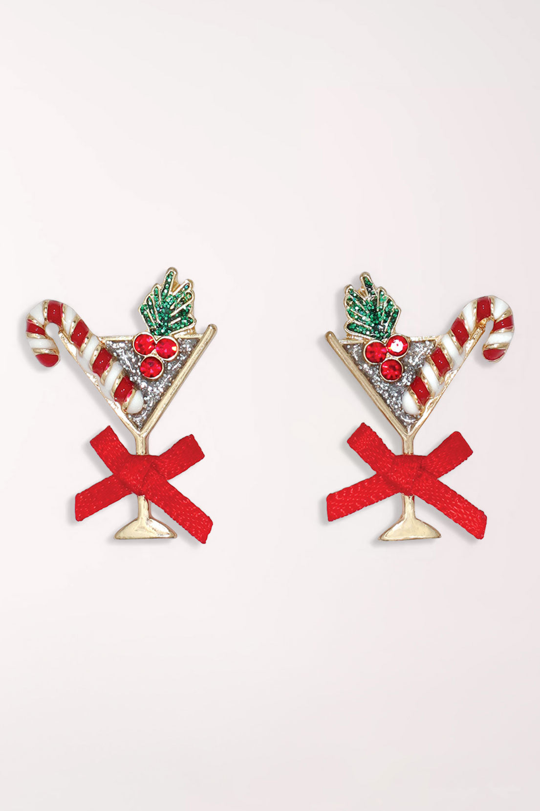 Pair of Periwinkle Holiday Martini Earrings: gold-tone martini glass studs set with clear crystals, with a red and white candy cane, green holly with red berries, and a red fabric bow on each stem.