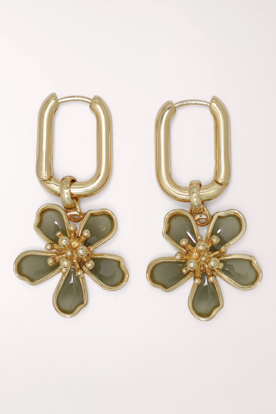 Pair of Periwinkle Blossom Charm Gold Huggie Hoop Earrings: rectangular gold-tone huggie hoops with dangling five-petal flower charms in sage green enamel, outlined in gold with a gold stamen center.