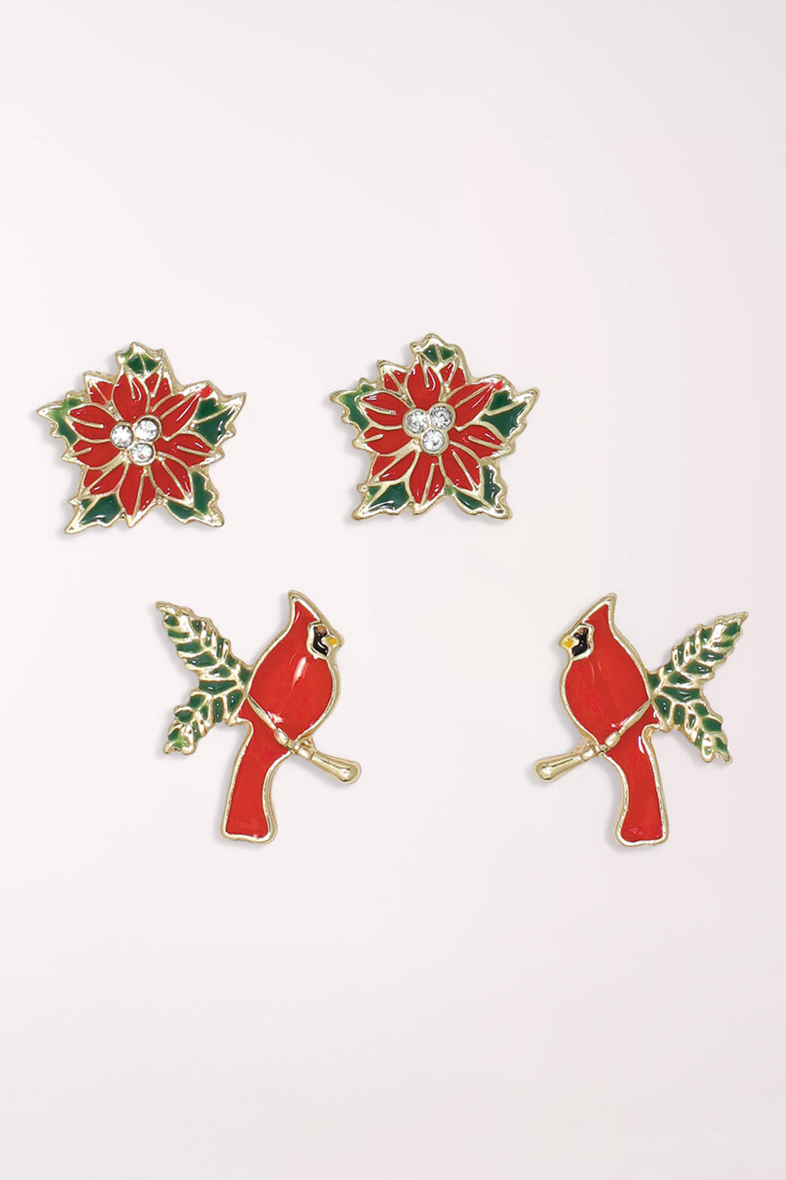 Periwinkle Cardinals And Poinsettias Earrings Set with two pairs of studs: red enamel poinsettias with crystal centers and red enamel cardinals perched on green leafy branches, all with gold-tone edges.