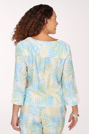 Woman wearing a tie-dye outfit on a white background