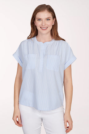Woman wearing a blue and white striped shirt against a white background