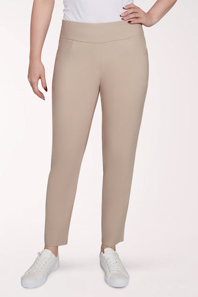 Beige leggings worn by a person on a white background