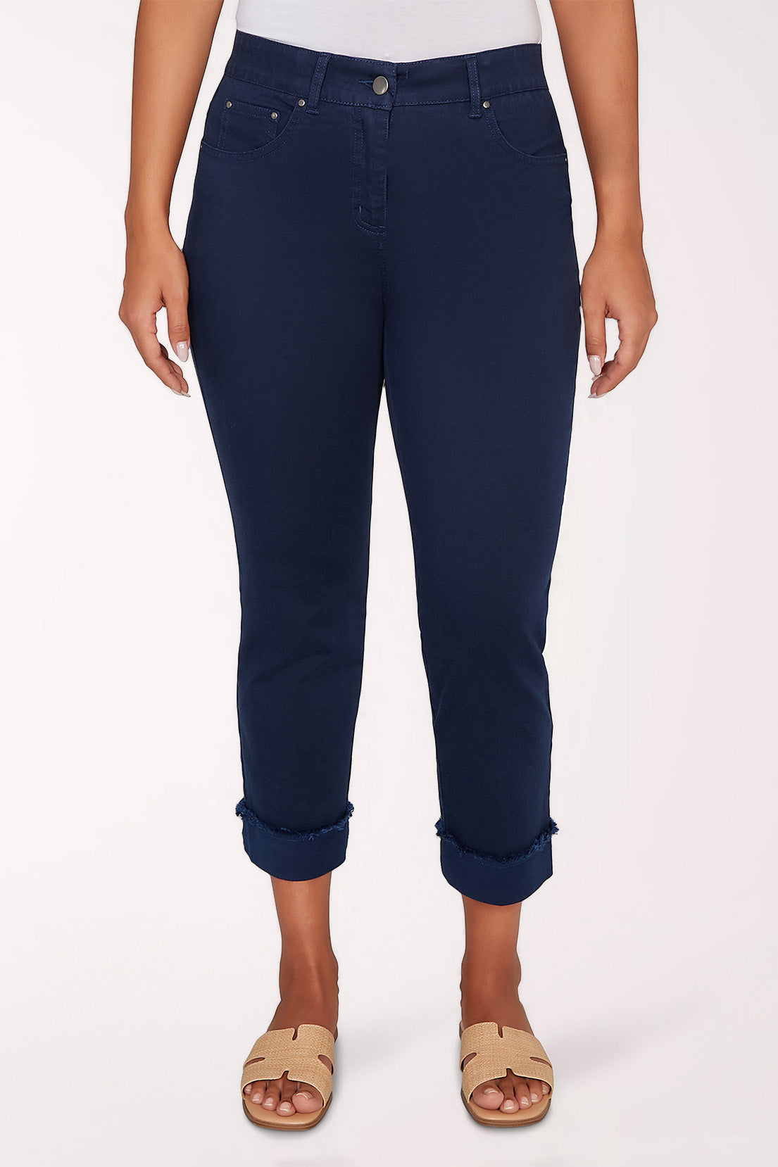 Navy blue pants worn by a person on a white background