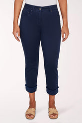 Navy blue pants worn by a person on a white background