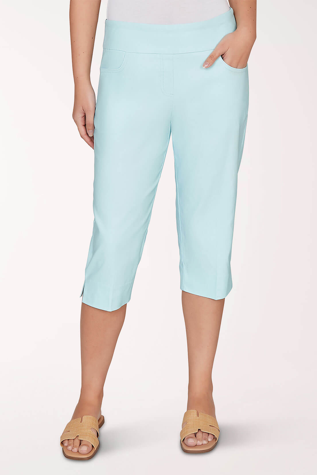A light blue capri pant worn by a woman on a light pink background