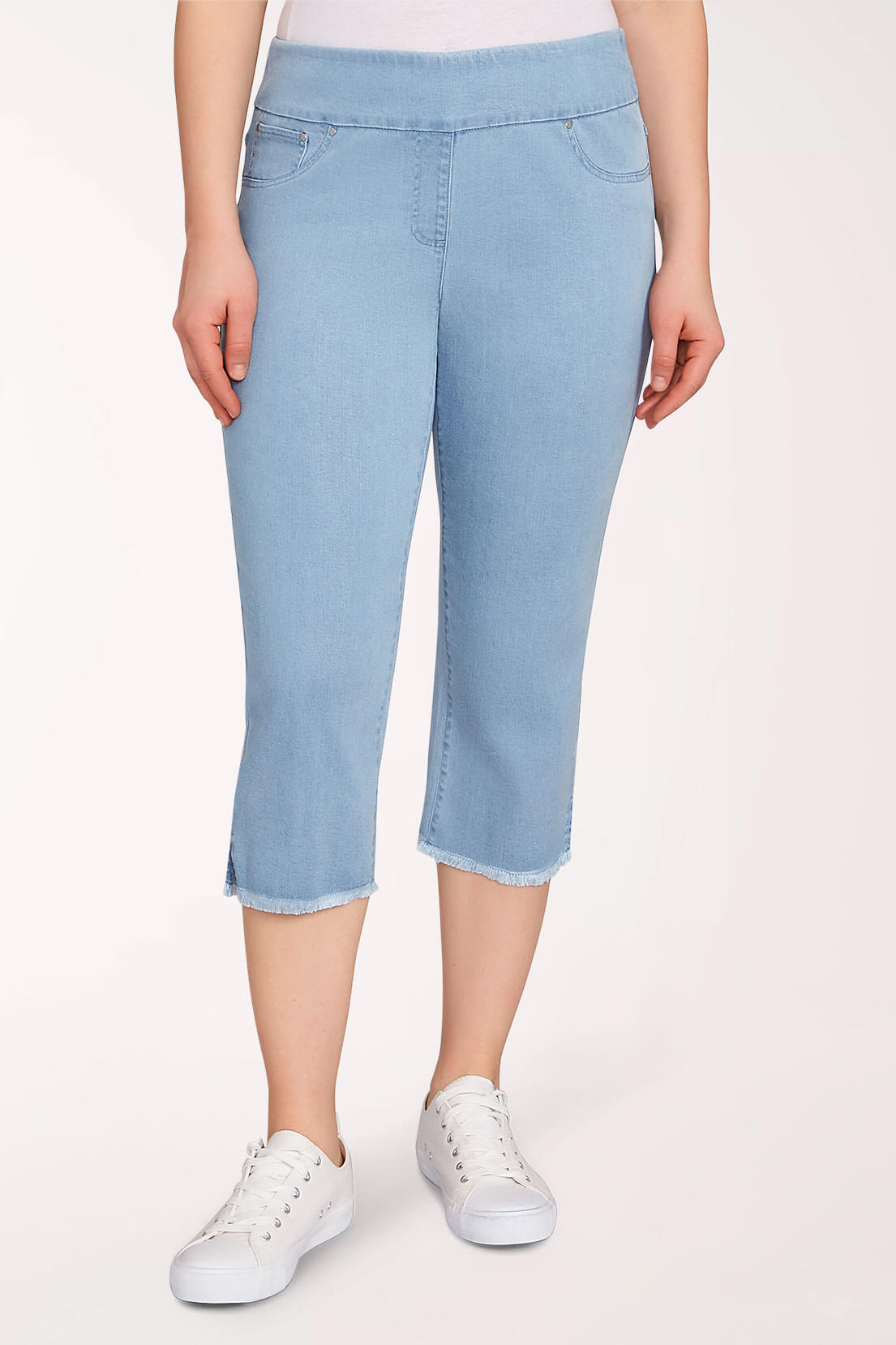 Light blue capri pants worn by a person on a white background