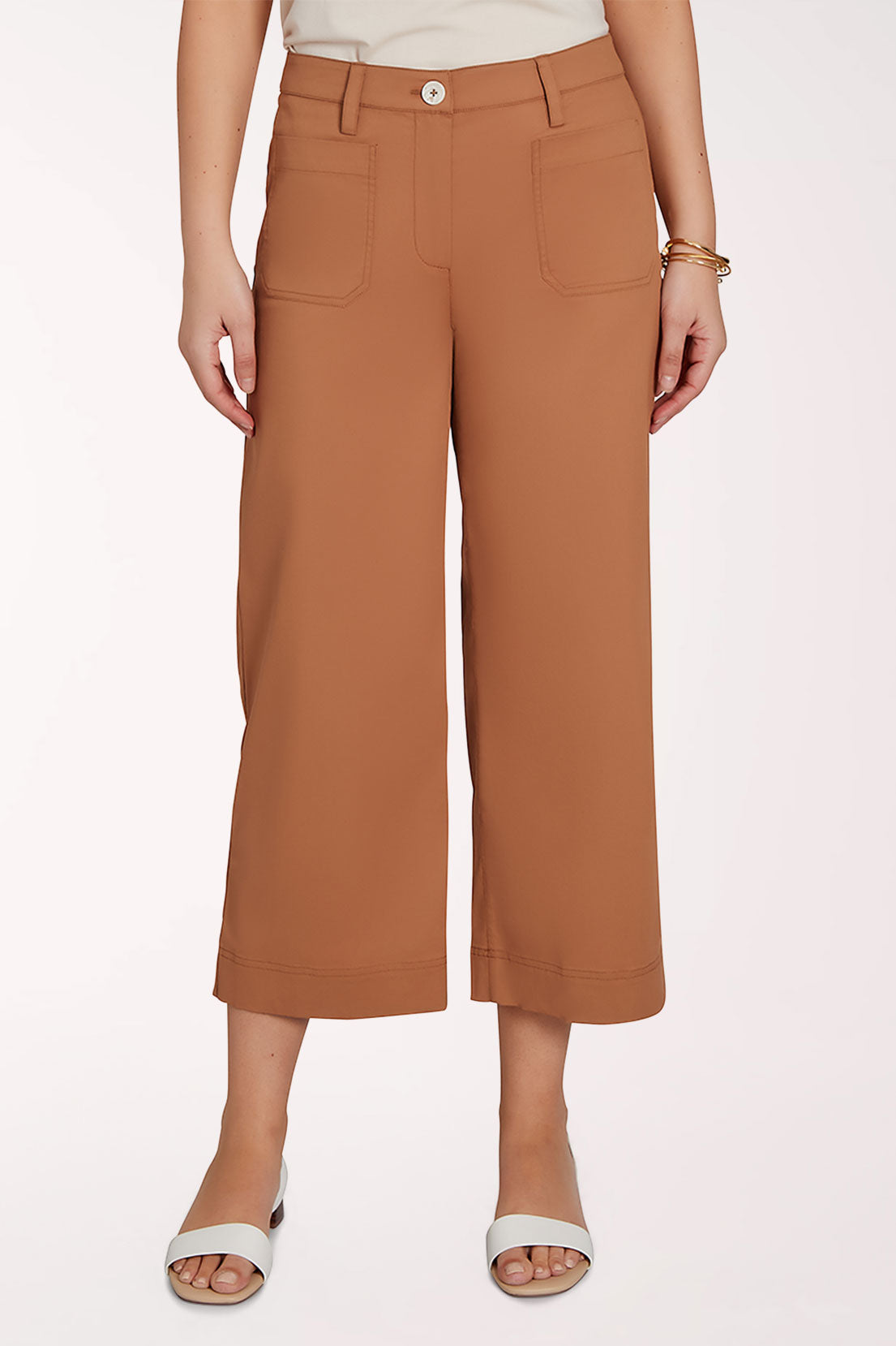 Brown wide-leg pants worn by a person on a white background