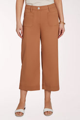 Brown wide-leg pants worn by a person on a white background