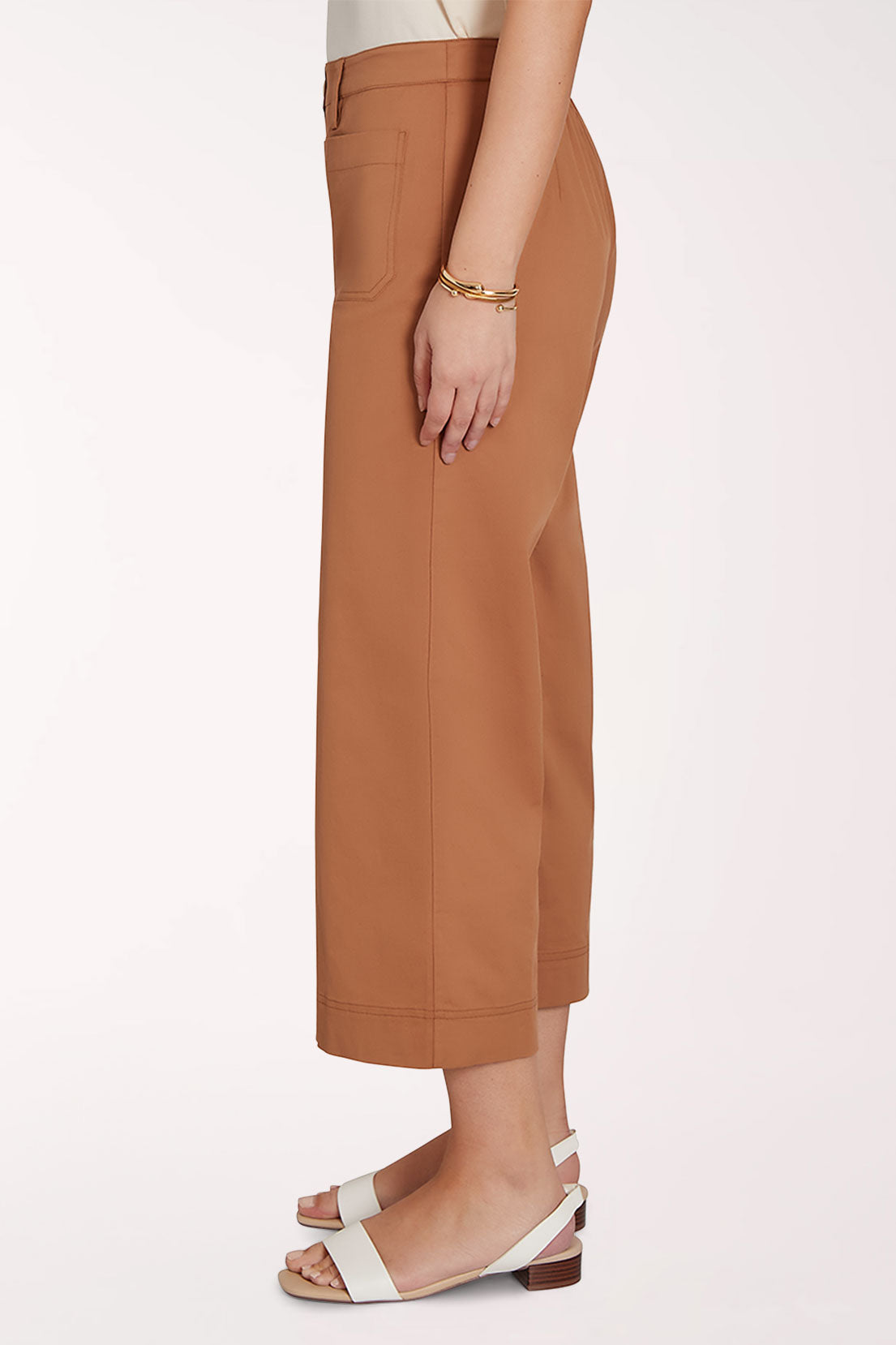 Brown wide-leg pants worn by a person on a white background