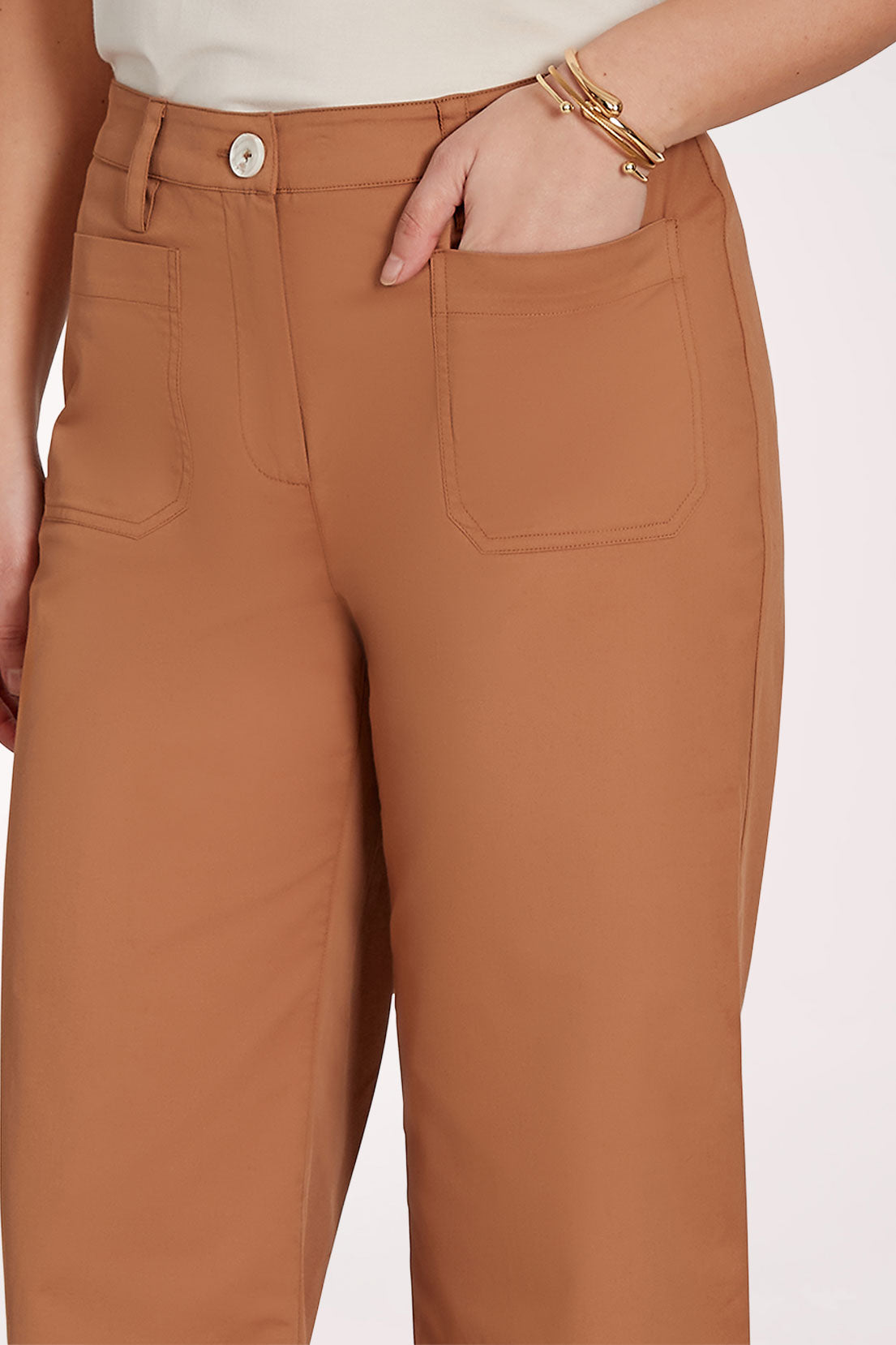 Brown wide-leg pants worn by a person on a white background