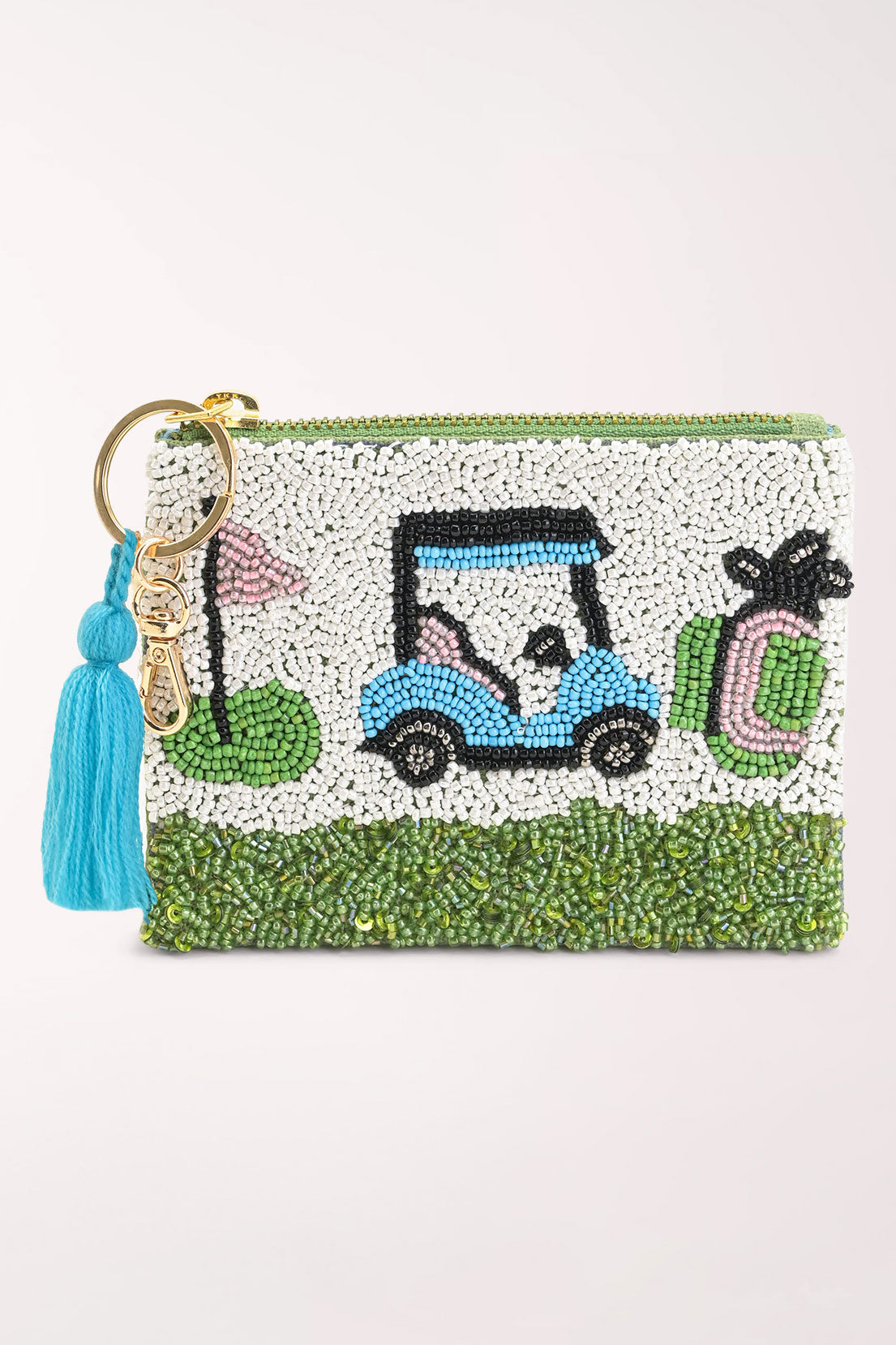 A small zip pouch decorated with green and white beading, featuring a blue and black beaded golf cart, a pink flag, and a pink-and-green beaded golf bag. It has a gold-tone key ring with a bright blue tassel.