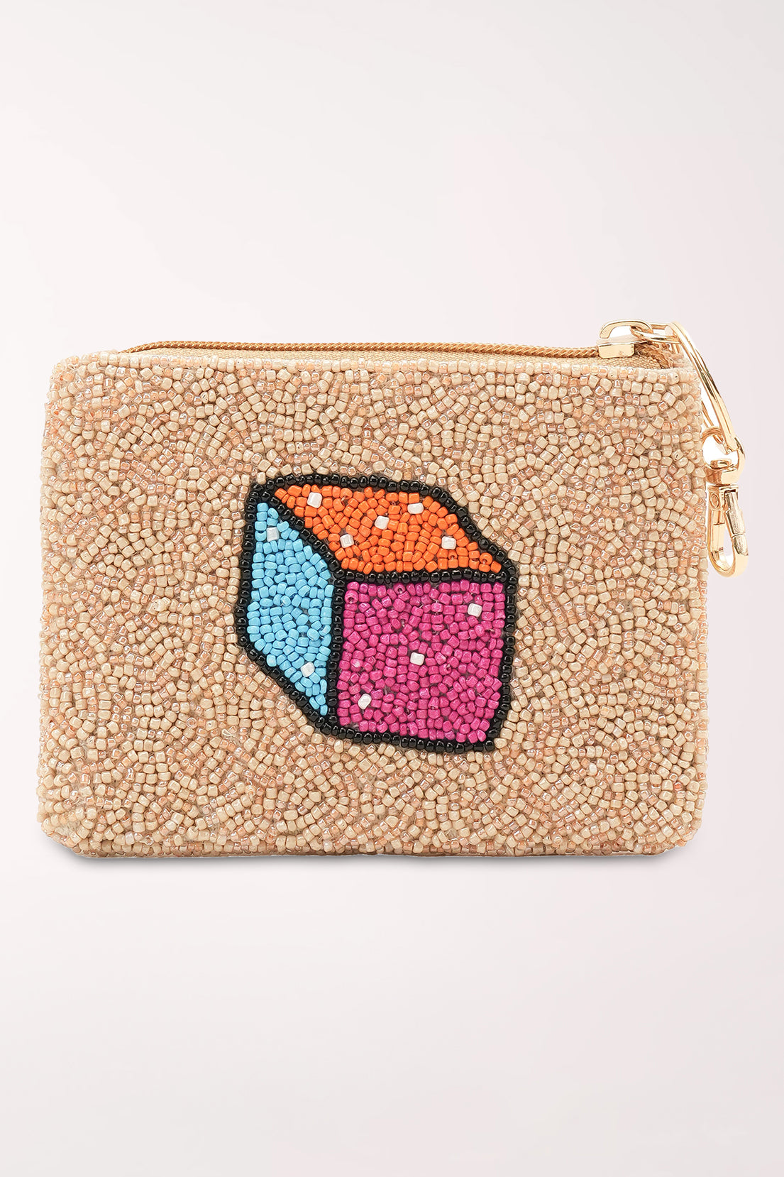 A small zip pouch covered in beige seed beads with colorful embroidered-style motifs including a cocktail glass, a cube, a letter M, and botanical cards.