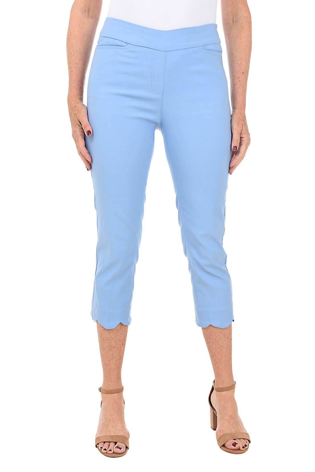 Light blue capri pants worn by a person on a white background