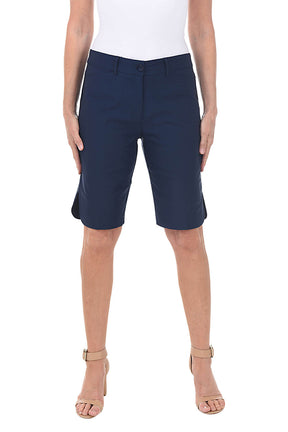 Navy blue shorts worn by a person on a white background