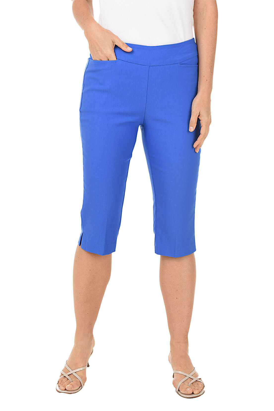 Person wearing blue capri pants on a white background