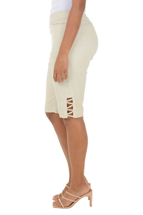 Side shot of a model in beige shorts