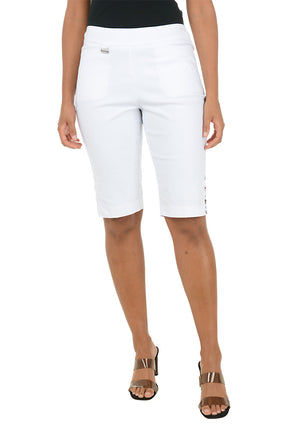 Person wearing white bermuda shorts on a white background.