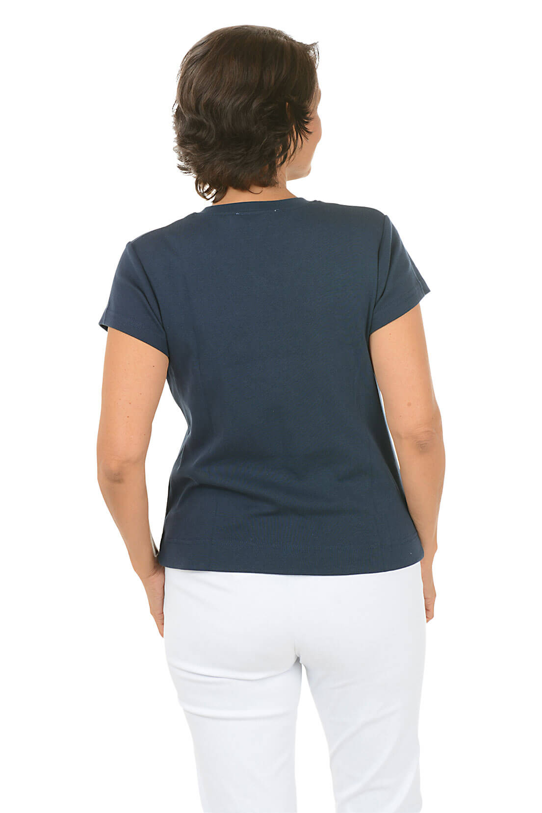 A woman viewed from the back wearing a dark navy blue short-sleeve t-shirt and white pants, set against a plain white background.