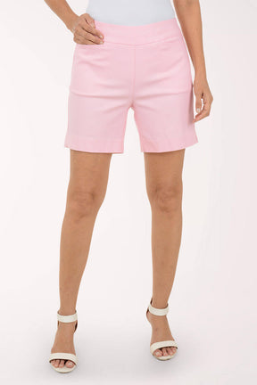 Person wearing pink shorts on a white background