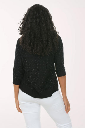 Woman wearing a black cardigan with sequin details on a white background