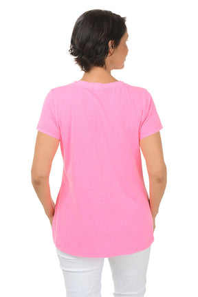 Person wearing a pink t-shirt on a white background