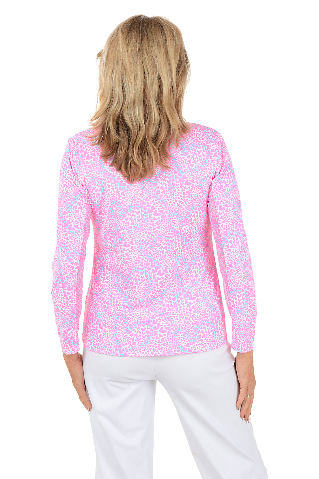 Woman wearing a pink floral long-sleeve top on a white background. Back shot.
