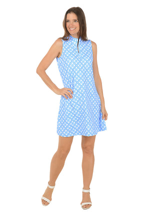 Woman wearing a blue patterned dress on a white background