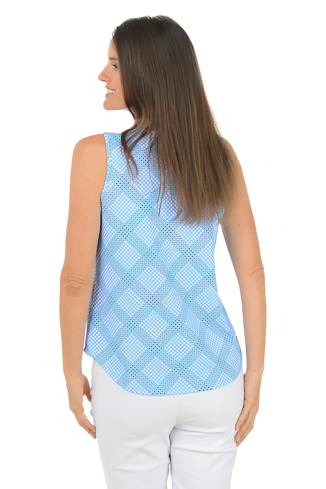 Woman wearing a light blue checkered sleeveless top and white pants on a white background. Back shot.