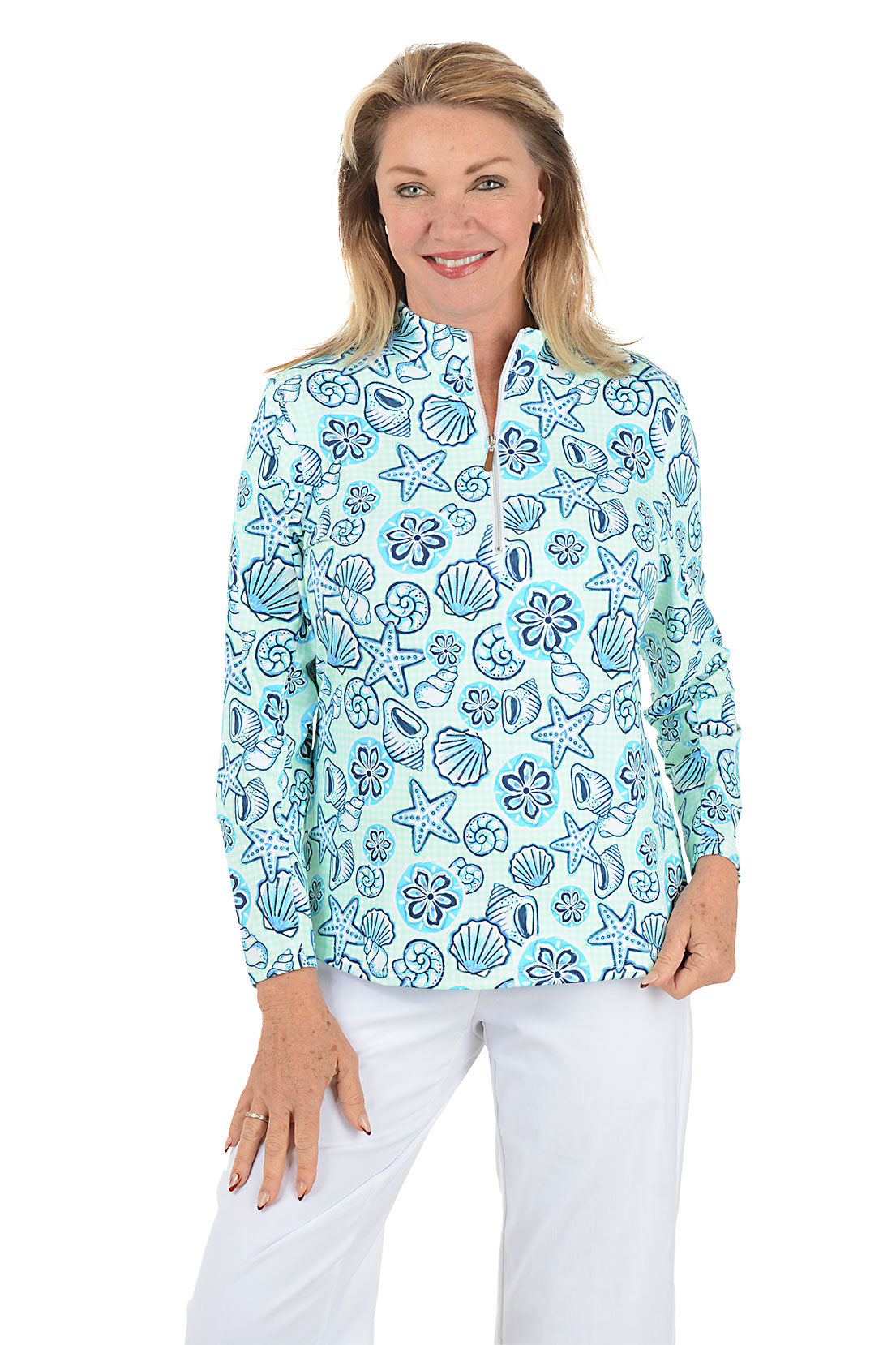 Woman wearing a blue floral patterned blouse on a white background.