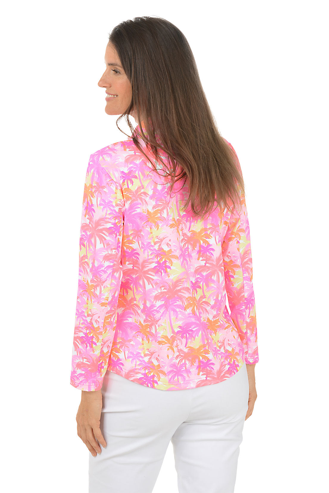 Woman wearing a colorful floral long-sleeve shirt on a white background. Back shot.