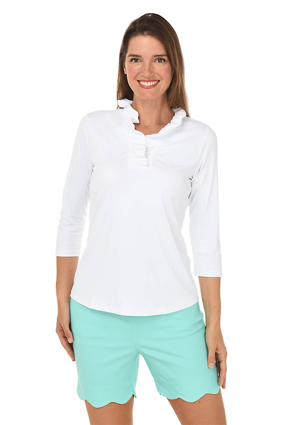 Woman wearing a white long-sleeve shirt and light green shorts on a white background