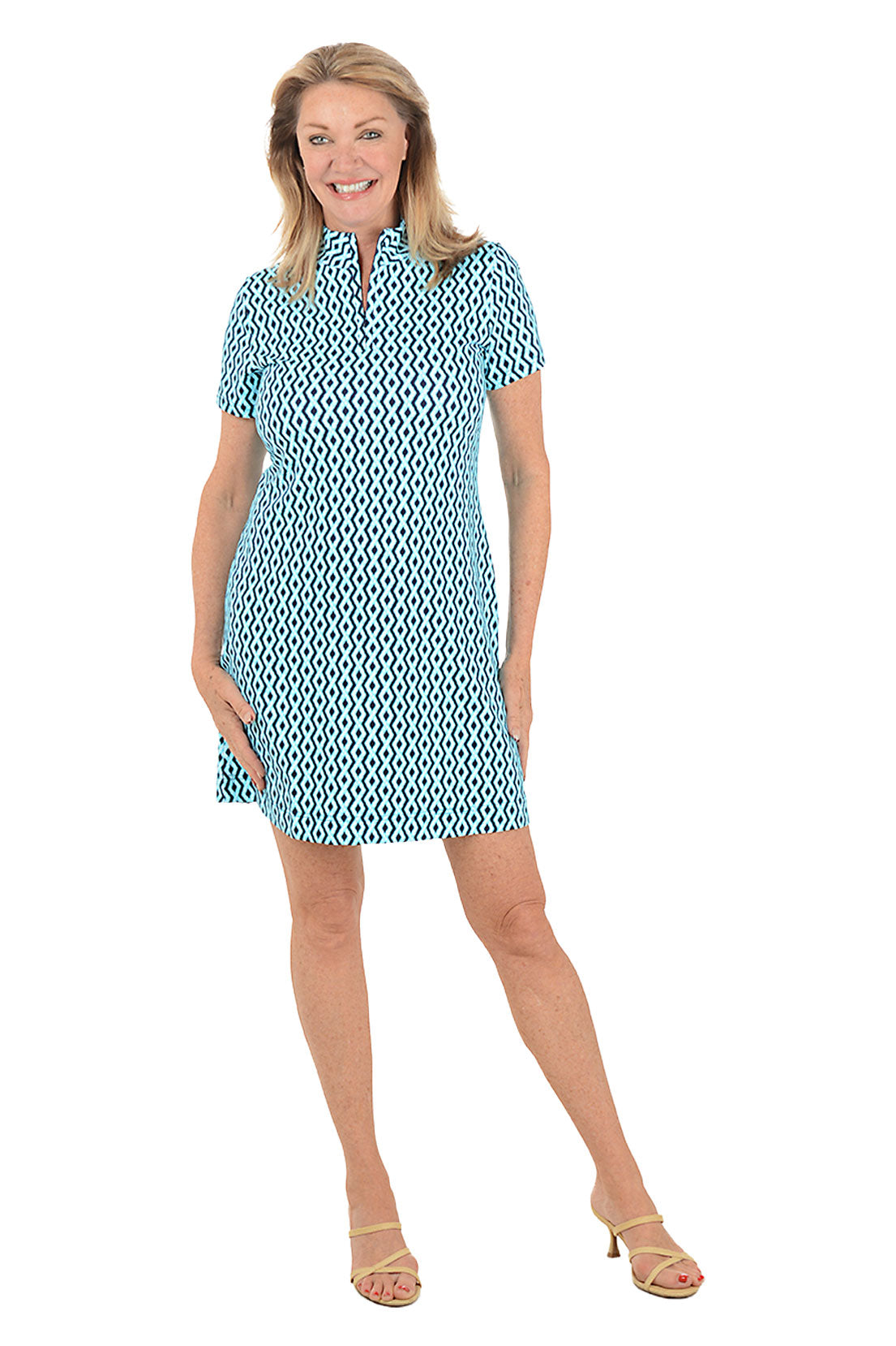 Woman wearing a patterned dress on a white background. Second front shot.