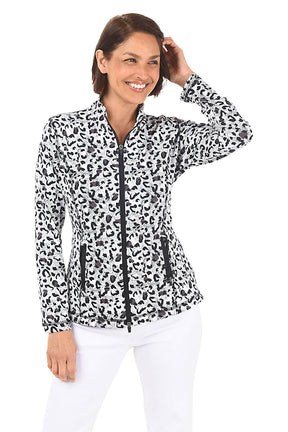 A woman wearing a black and white leopard-spotted zip front jacket and white pants in front of a white background. Alternate front shot.
