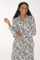 Front shot of a model wearing a neutral floral print on a sun shirt
