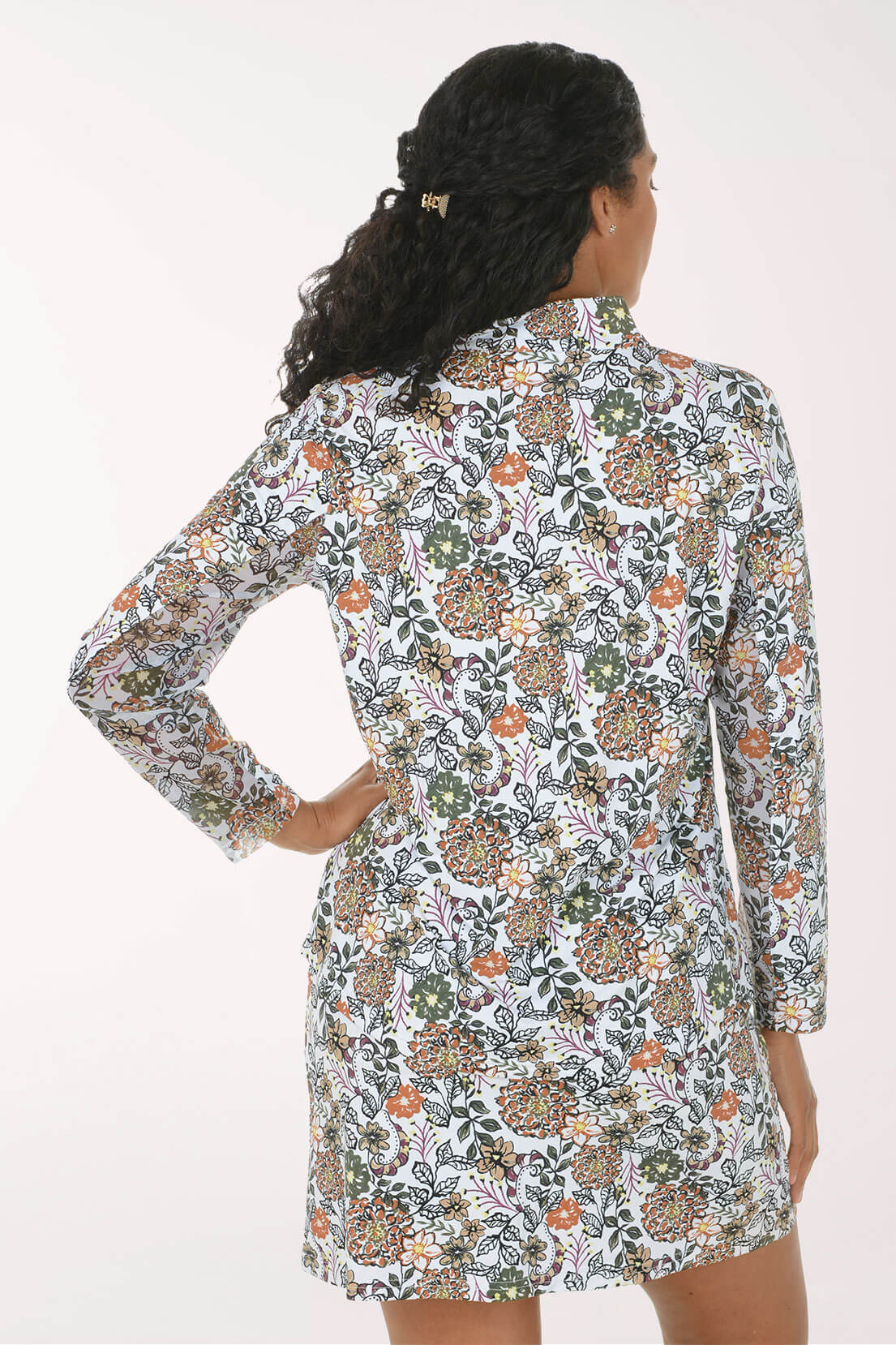 Back shot of a model wearing a neutral floral print on a sun shirt