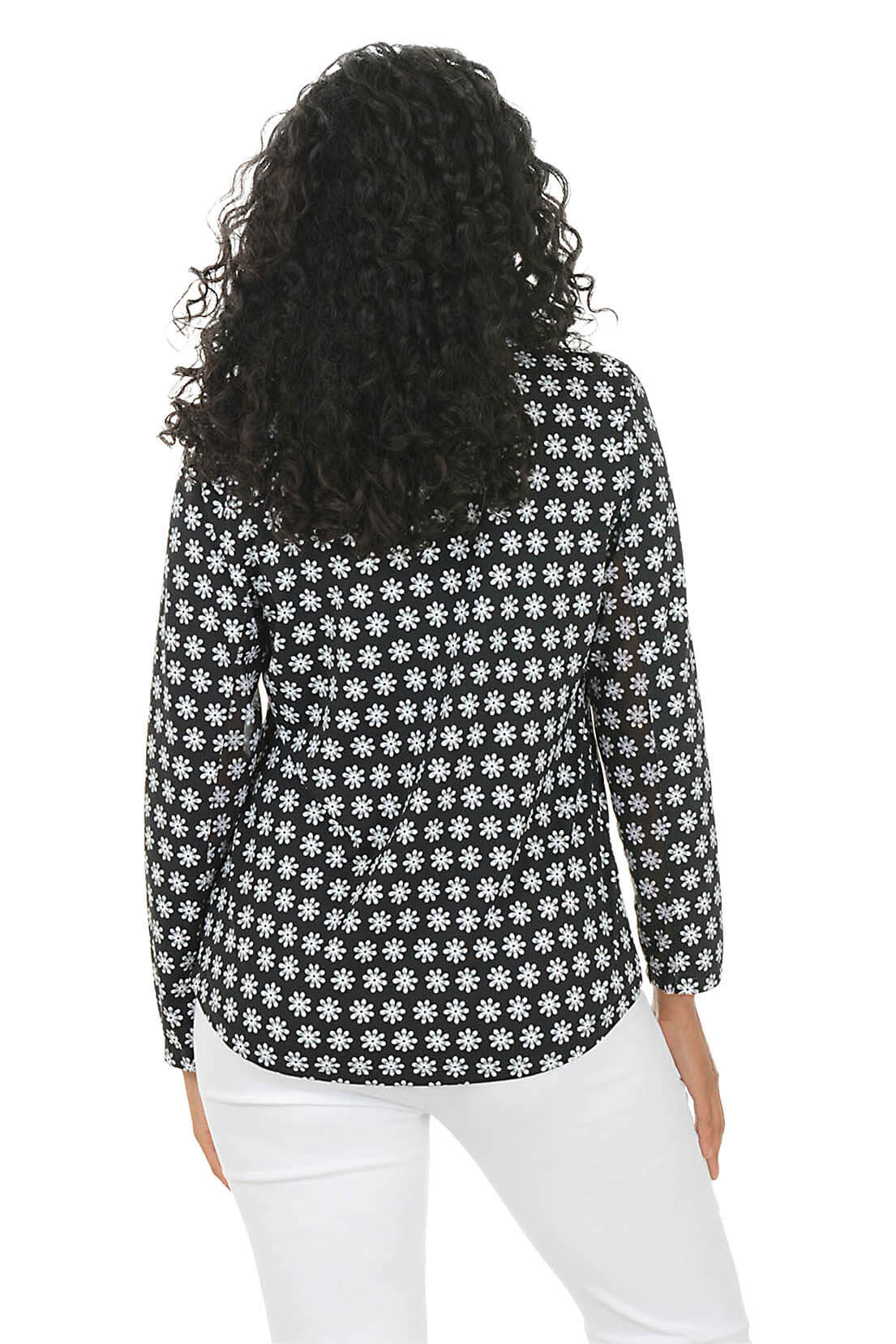 Woman wearing a black and white patterned sun shirt with a zipper on a white background. Back shot.