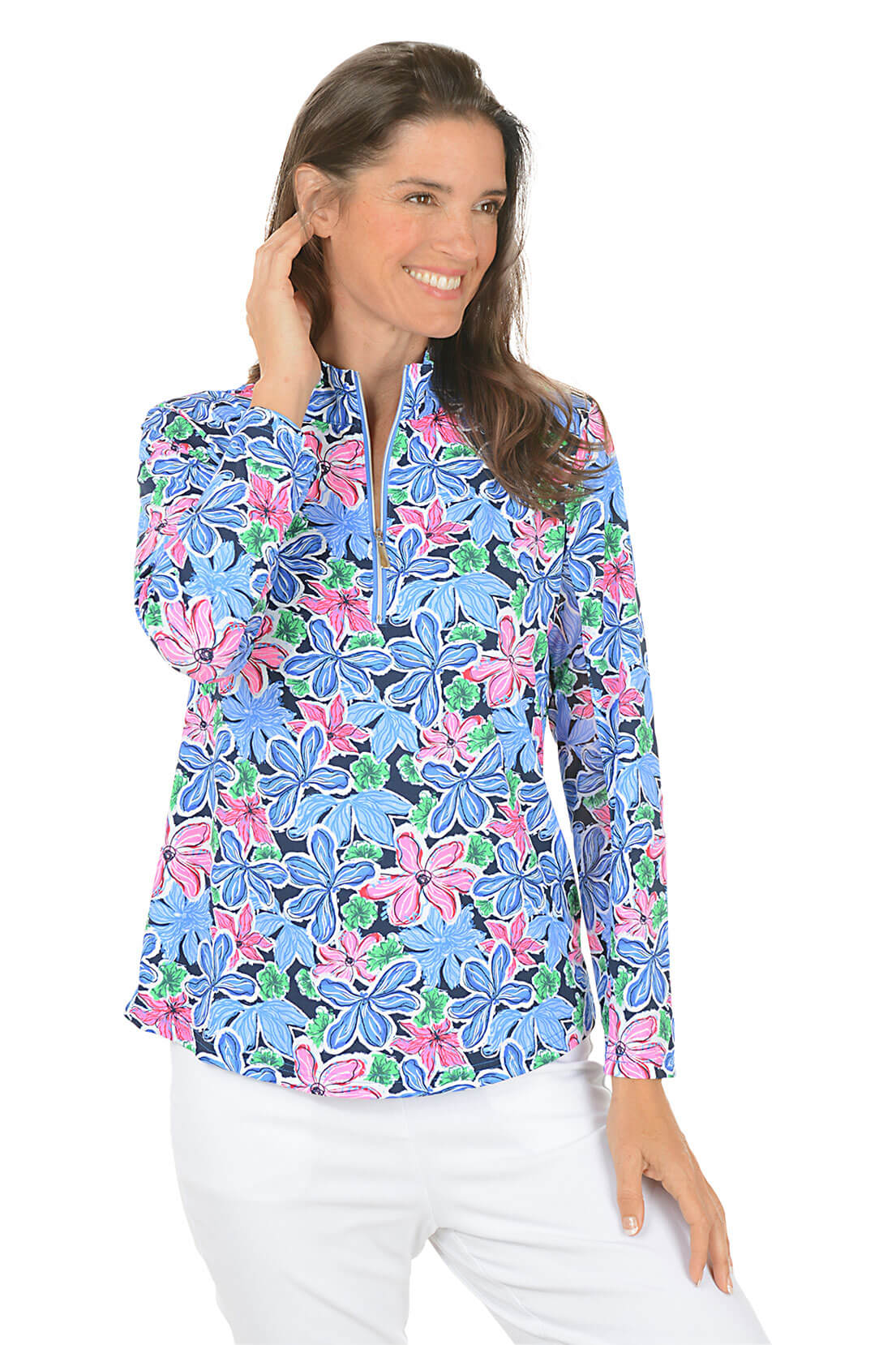 Woman wearing a colorful floral blouse with a white background