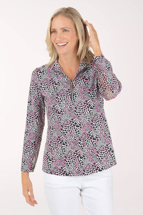 Woman wearing a patterned blouse with a white background