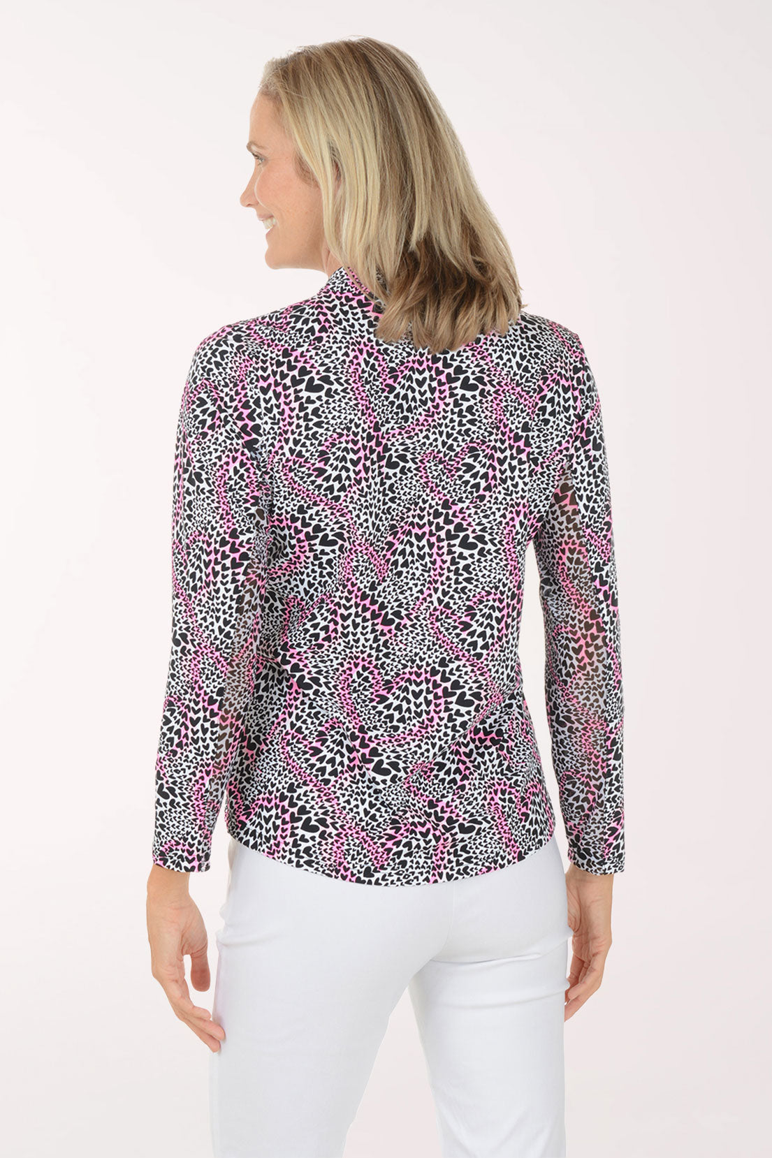 Woman wearing a patterned blouse with a white background