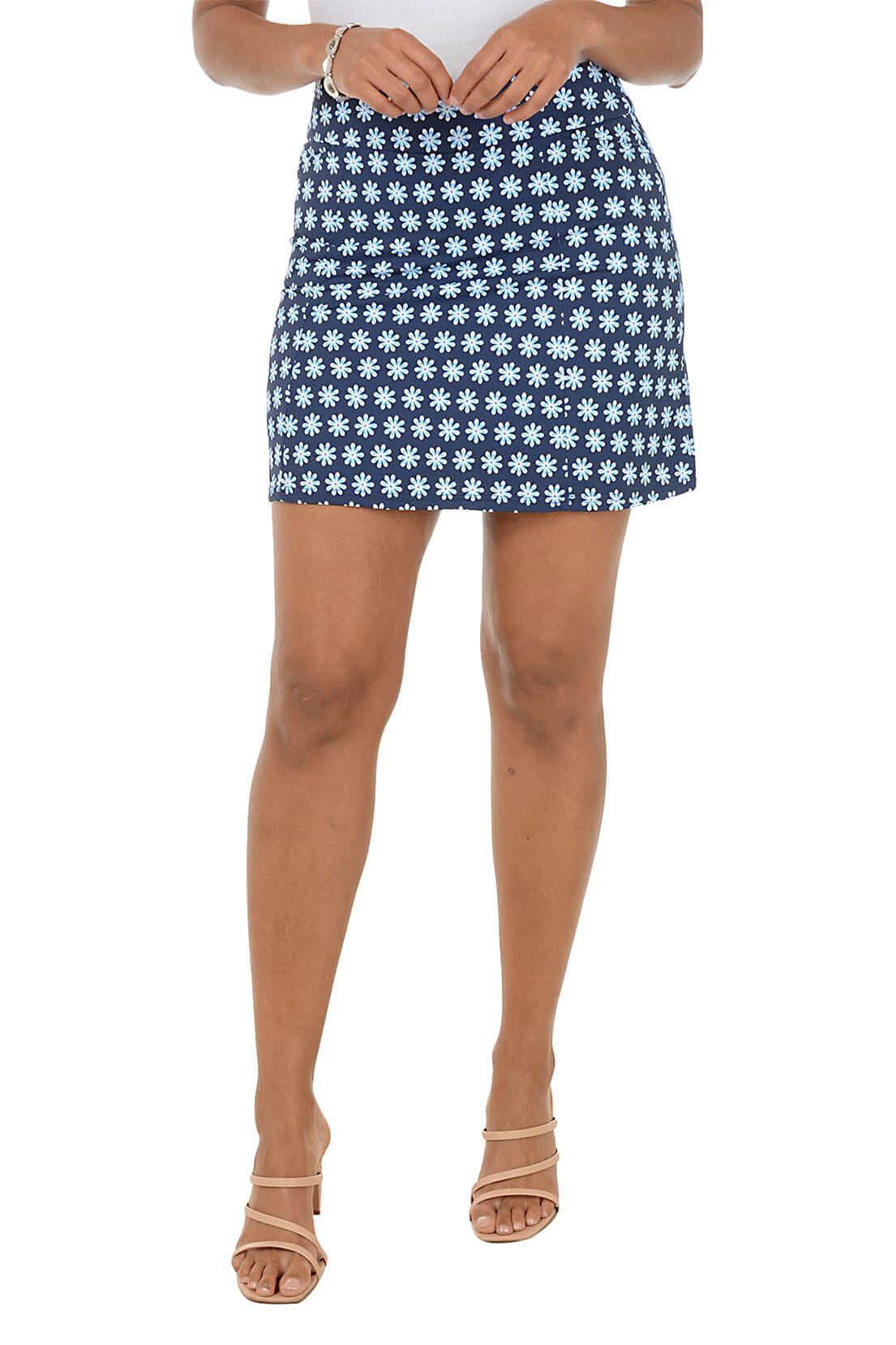 Person wearing a blue and white patterned skirt on a white background