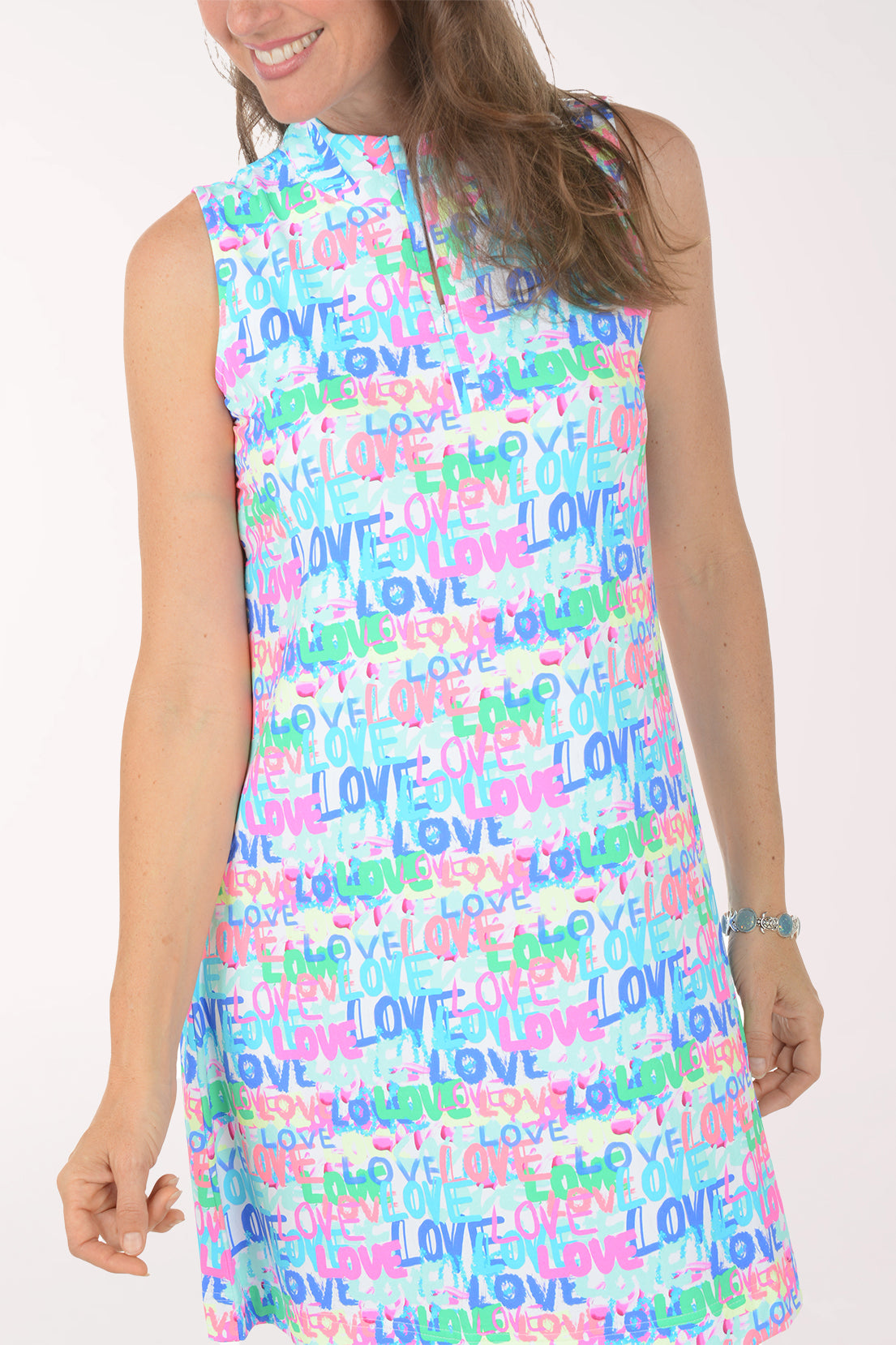 Woman wearing a sleeveless dress with colorful 'LOVE' pattern on a white background