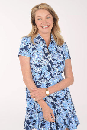 Woman wearing a blue floral dress on a white background
