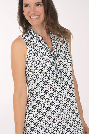 Woman wearing a black and white floral dress on a white background