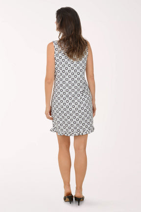 Woman wearing a black and white floral dress on a white background